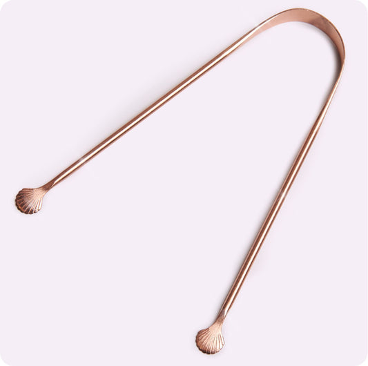 tongschaper van koper met zeeschelpen